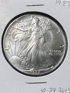 lot 70 image: 1987 AMERICAN SILVER EAGLE 1 TROY OZ .999 FINE SILVER