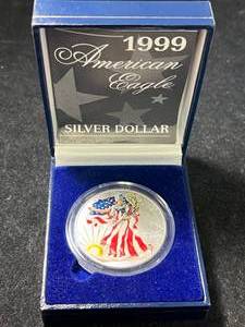 lot 91 image: 1999 AMERICAN SILVER EAGLE 1 TROY OZ .999 FINE SILVER IN COLOR