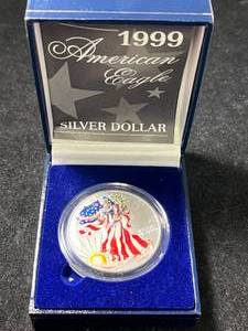 lot 92 image: 1999 AMERICAN SILVER EAGLE 1 TROY OZ .999 FINE SILVER IN COLOR
