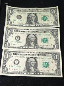 lot 103 image: 3 CONSEC SERIAL NUMBERED $1 BILLS