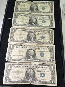 lot 104 image: 5 US BLUE SEAL $1 SILVER CERTIFICATES