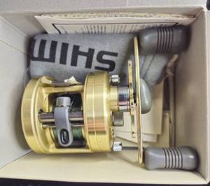 lot 1 image: Shimano Calcutta 250 Baitcasting Reel, shows some wear works very well