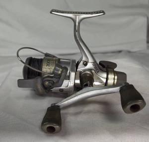 lot 7 image: Shimino Spirex 2000RB Spinning Reel, shows wear, work very well