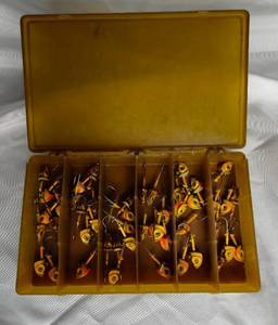 lot 15 image: Tackle box with 48 Northland Mimic Minnow 12 oz Jig heads.