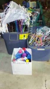 lot 766 image: Hangers, Rubbermaid 28 Gallon And Laundry Supply Partials.