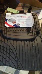 lot 665 image: New Weather Tech 4pc Trim To Fit Floor Mat Set.