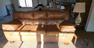 lot 577 image: Leather Couch, End Table and lamp.