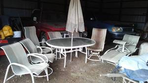 lot 864 image: Patio Set. Table, Umbrella, Swivel Chairs (4) Chairs and More.