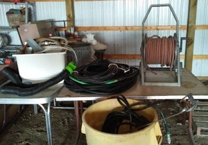 lot 827 image: Large Lot of Hose Variety and Utility Sink.