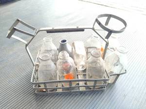lot 106 image: Antique Milk Carrier & Bottles