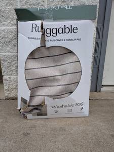 lot 27 image: RUGGABLE 8x10 MACHINE WASHABLE RUG COVER & NONSLIP PAD