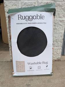 lot 28 image: RUGGABLE 8x10 MACHINE WASHABLE RUG COVER & NONSLIP PAD