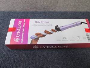 lot 29 image: Lyealion Automatic Hair Curling Lio...