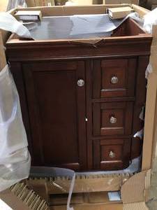 lot 1 image: Home Decorators Collection Naples 24 in. W x 21.63 in. D x 34 in. H Bath Vanity Cabinet without Top in Tobacco Customer Returns See Pictures
