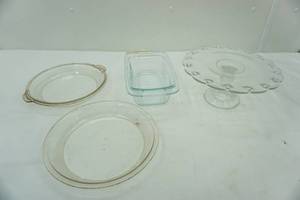 lot 88 image: Pyrex Bread pan, pie plates, & cake plate