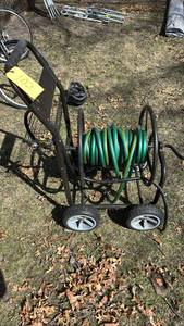 lot 102 image: Garden Hose Reel Cart, Holds Up to 150 ft, Metal Frame, Plastic Wheels
