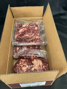 lot 101 image: Box of Frozen Beef Ribeye Roll Steaks with Seasoning 9.40LBs