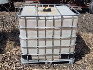 lot 17 image: Empty 275 Gallon IBC Tote Container