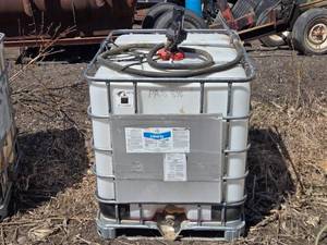 lot 18 image: Used IBC Tote that had Liberty 280 SL Herbicide with 12v Pump