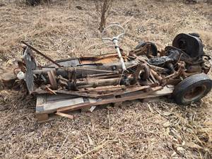 lot 42 image: Rusty Chassis Frame with Steering Wheel and Automotive Components - Volkswagen