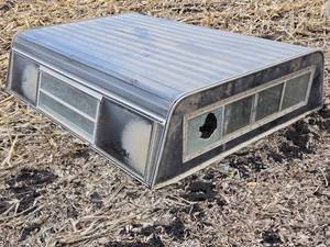 lot 73 image: Used Truck Bed Camper Shell with 1 Broken Window Total Length 83