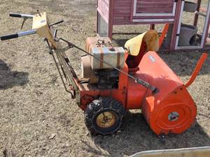 lot 204 image: Allis-Chalmers Snow Blower with Chains - Runs, May Need Carb Adjustment or Cleaning