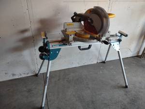 lot 11 image: Dewalt 12 Miter Saw with Stand...