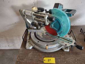 lot 89 image: Makita 10 Sliding Miter Saw...