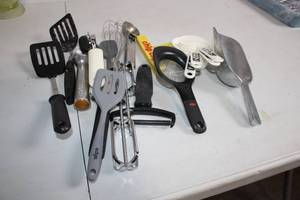 lot 39 image: Assorted Kitchen Utensil Set including Spatulas, Whisk, and Measuring Cups
