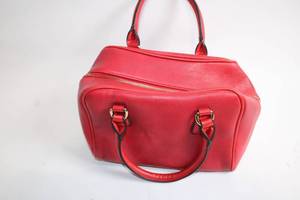 lot 146 image: Red Faux Leather Handbag with Decorative Tassel Zipper Pull