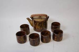 lot 387 image: Vintage Handcrafted Pottery Tea Set with Floral Design