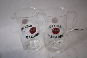 lot 466 image: Pair of Bacardi Logo Glass Pitchers