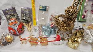 lot 13 image: Christmas Lot with Tin Santa holding Pipe, Foil Decorations, SleighReindeer