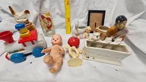 lot 21 image: Bunny Covered Dish, Rubber Doll, Rattle, Alvin Chipmunk Glass, Planters