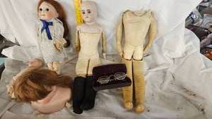 lot 95 image: Misc Porcelain Dolls, parts, and Leather Bodies and Ben Franklin Style Vintage Glasses