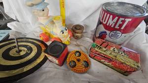lot 97 image: Top, Horseshoe Toss Game, Rubber TrainConductor Toy