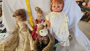 lot 103 image: Assorted Dolls and Doll Stand