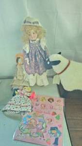 lot 30 image: Strawberry Shortcake PosterStickers, Porcelain Dolls and Doll Stands