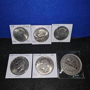 lot 16 image: 5 Ike Dollars Carded in VF and VG Condition and Street Outlaws 2022 Token