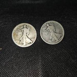 lot 31 image: (2) Walking Liberty Half $, worn