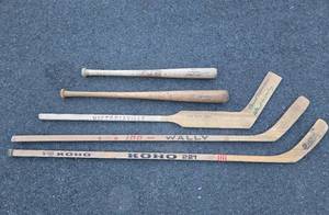 lot 127 image: Group of Vintage Wooden Hockey Sticks & Baseball Bats