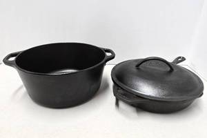 lot 261 image: LODGE Cast Iron Dutch Oven & Skillet - Lid fits Both Perfectly
