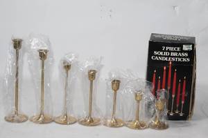 lot 3 image: Set of 7 Solid Brass Candlesticks by Target
