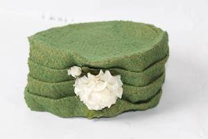 lot 12 image: Vintage Green Wool Cloche Hat with Floral Accent