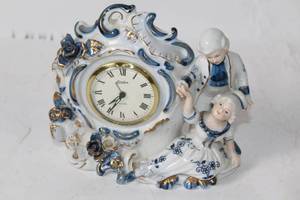 lot 51 image: Vintage Porcelain Clock with Children Figurine Design
