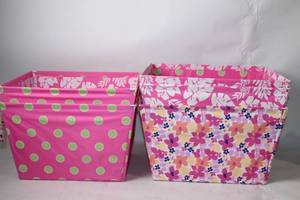 lot 61 image: Pair of Pink Fabric Bins with Tropical and Floral Designs