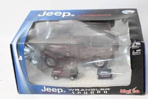 lot 301 image: Maisto Jeep Wrangler Sahara Die-Cast Model with Display Case