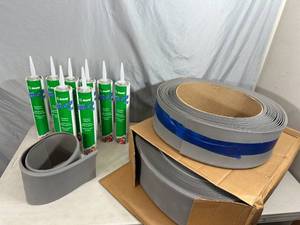lot 71 image: New Rolls of Commercial Vinyl Baseboard and Adhesive