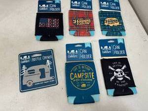 lot 144 image: New Camping Themed Can Coolers and Magnetic Bottle Opener