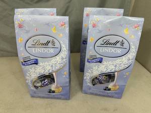 lot 253 image: 4 New Bags of Lindt Special Edition Blueberries and Cream White Chocolate Truffles.